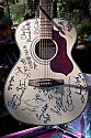 Autographed guitar raffle prize.