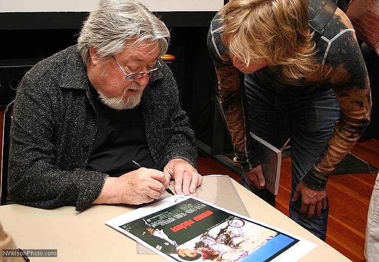 Cinematographer L�szl� Kov�cs autographs an "Easy Rider" movie poster at the inaugural Mendocino Film Festival in 2006.