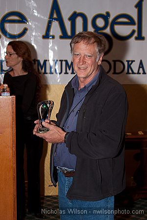 Filmmaker Alan Dater receives the Award for Best Documentary for his
        film "Taking Root."