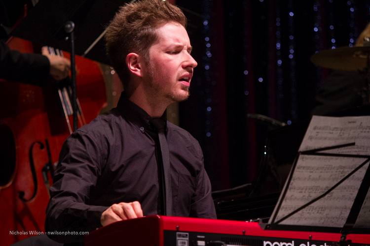 Julian Pollack on piano wih the MMF Jazz Big Band.