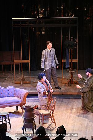 Schaunard (John Dooley, baritone) a composer, arrives at the bohemians' garret.