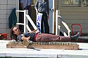 Flynn Creek Circus performer on a bed of nails.