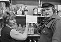 Byrd Baker (r) and clerk at Mendocino's liquor store show a sign reading "No sake until Japan stops killing whales."