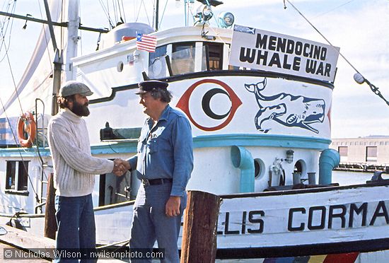 Greenpeace Foundation President Robert Hunter greets Mendocino Whale War leader Byrd Baker before the MWW anti-whaling voyage in 1976.