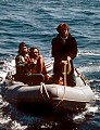 Greenpeace President Bob Hunter and two others in Zodiac prepare to board the Mendocino Whale War boat for a strategy meeting.