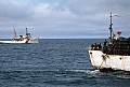 The U.S. Coast Guard observes as a South Korean crab boat puts out hundreds of pots on long lines just outside the 12-mile limit in July 1976.