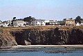 View of Mendocino on the bluffs from aboard the Phyllis Cormack anchored in Mendocino Bay.