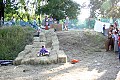 Kids on hay bale slide