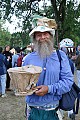 "Bro Chapeau" Mark Hansen shows some samples from his paper hat making workshop