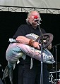 Wavy Gravy with a fishy friend on the main stage