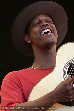 Eric Bibb on the main stage in his set with the Campbell Brothers