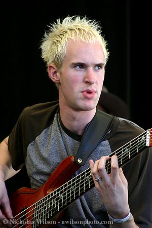 Campbell Brothers bass player Malcolm Kirby with six-string bass guitar