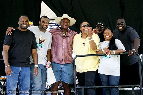 The Campbell Brothers gospel music band backstage after a sensational, high-energy set on the main stage of the Kate Wolf music festival 2005. Guest singer Linda Tillery in yellow shirt; unidentified man in western hat.