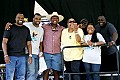 The Campbell Brothers gospel music band backstage after a sensational, high-energy set on the main stage of the Kate Wolf music festival 2005. Guest singer Linda Tillery in yellow shirt; unidentified man in western hat.