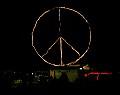 The 12' diameter lighted peace symbol glows in the backstage dining area after the music ends