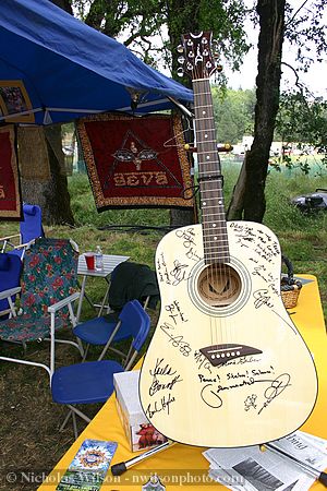Many performers signed this guitar to be raffled for a benefit for Seva Foundation.