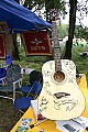 Many performers signed this guitar to be raffled for a benefit for Seva Foundation.