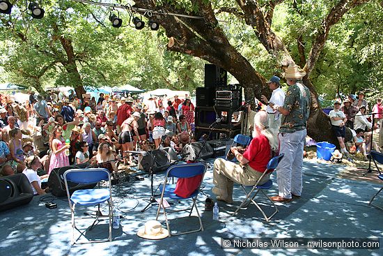 Hugh Shacklett, Utah Phillips and Wavy Gravy at the Hagler stage