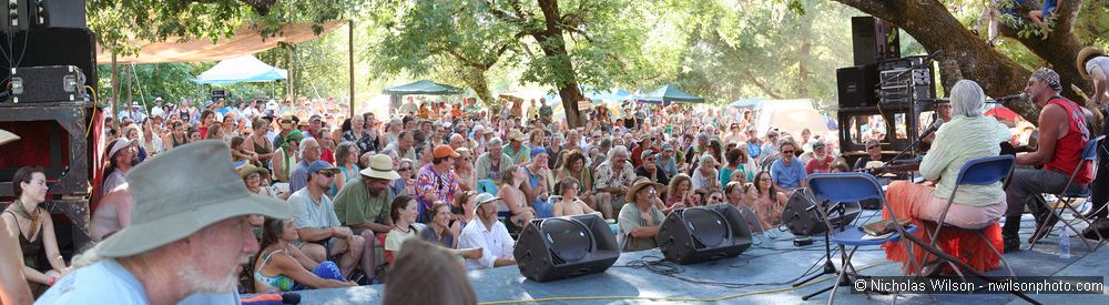 Greg Brown, Rosalie Sorrels and Bo Ramsey at the Hagler stage. Merged panoramic.