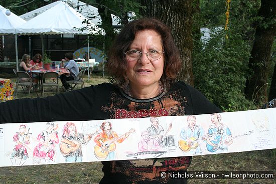 An artist shows her sketches of performers