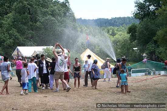 Water spray helps beat the heat Sunday afternoon.