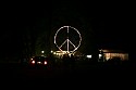 View of the lighted giant peace symbol backstage