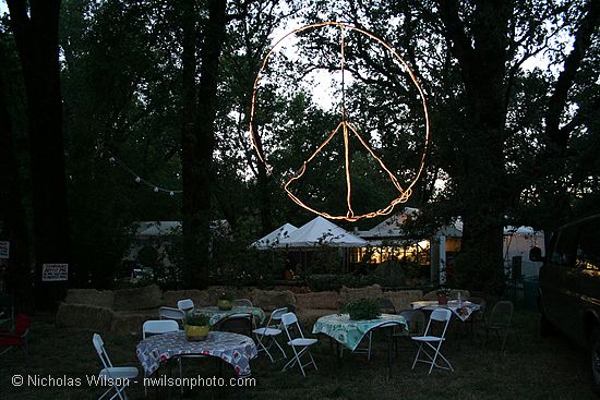 Lighted peace symbol backstage at the Kate Wolf Music Festival 2007