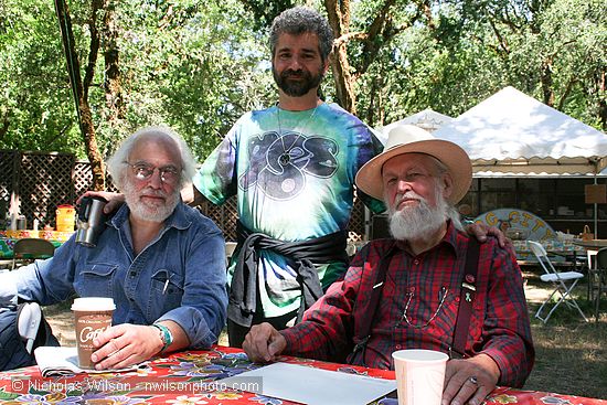 Utah Phillips backstage with Robbie Osman and Darryl Cherney (standing)