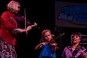 Hattie Craven on fiddle with Laura Love and Barbara Lamb