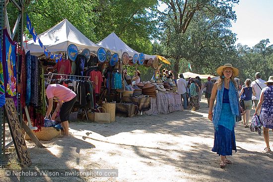 Hat vendor booth at the creekside entrance to the concert bowl