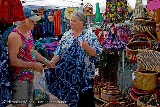 Ananse Village African imports booth with Rebecca and a customer