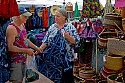 Ananse Village African imports booth with Rebecca and a customer