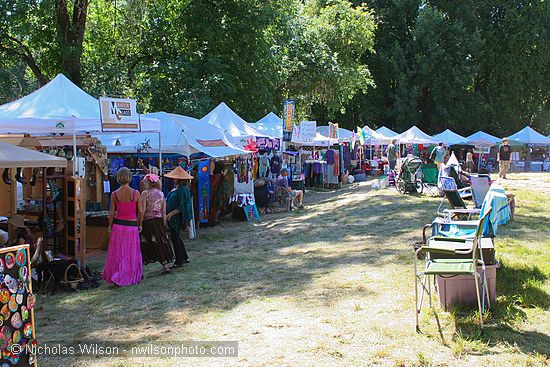 Craft vendor booths encircle the concert bowl