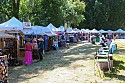 Craft vendor booths encircle the concert bowl