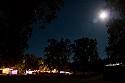 Moonlit view of the late night scene at the People's stage and beer garden.