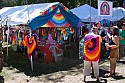 Craft vendor booths line the sides of the main concert meadow