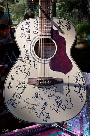 Autographed guitar raffle prize.