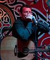 Catfish Jack blows harp at The People's Stage late Saturday night