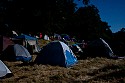 Riverside campground by the light of the full moon