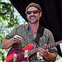 Guitar player with Rosalie Sorrels on the main stage Sunday morning