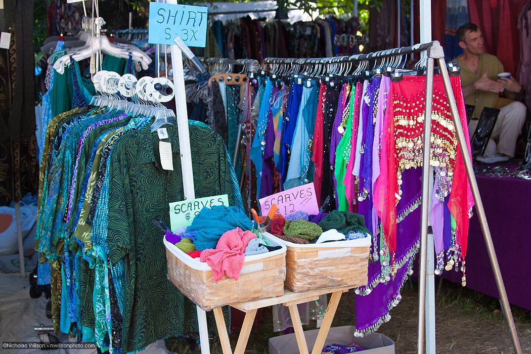 Vendor booths line the pathway to the main concert bowl.