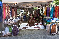 Vendor booths line the pathway to the main concert bowl.