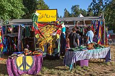 Vendor booths line the pathway to the main concert bowl.