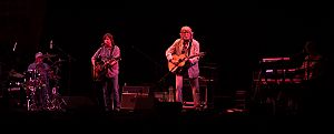 The Nitty Gritty Dirt Band are Jimmie Fadden (drums, harmonica), Jeff Hanna (guitar), John McEuen (guitar, banjo, mandolin, etc.), Bob Carpenter (keyboard, accordeon), and all of them sing too.