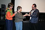 Cammie Conlon, left and MFF President Keith Brandman  presented a special award to Toni Lemos, longtime Mendocino County film office coordinator, who brought in dozens of feature film and TV commercial productions. Toni's daughter Jone Lemos accepted on her behalf. The presentation followed a special showing of the hit feature Summer of '42, filmed in Mendocino in 1971.