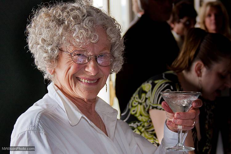 Gail Daly offers a toast with one of her freshly made martinis.