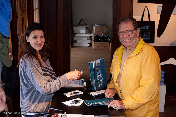 Retired lighting director and Mendocino Resident Rich Aguilar gets his film tickets from Maureen Leahy at the MFF box office.