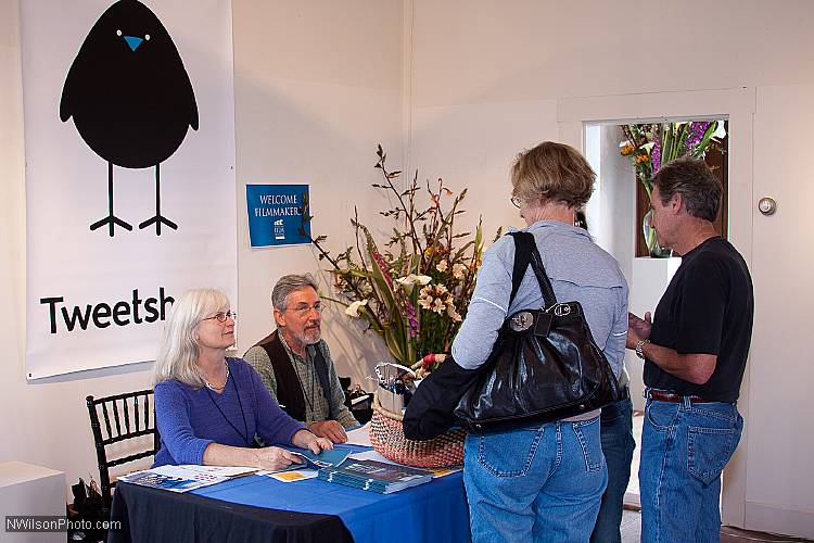 MFF volunteers Carole Freeman and James Sibbett greet arriving filmmakers.