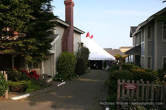 The entry to the Mendocino Film Festival's big top tent as seen from Ukiah St.  The tent site was the central courtyard of the Mendocino Hotel Garden Suites.