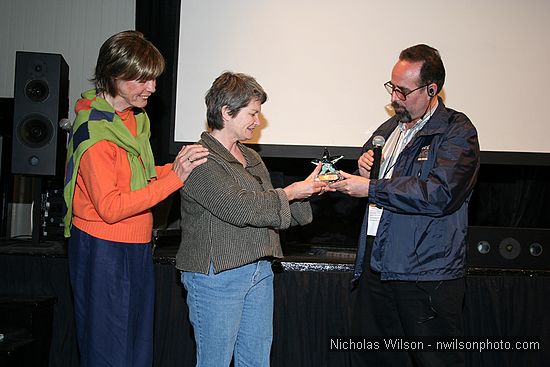 Cammie Conlon, left and MFF President Keith Brandman  presented a special award to Toni Lemos, longtime Mendocino County film office coordinator, who brought in dozens of feature film and TV commercial productions. Toni's daughter Jone Lemos accepted on her behalf. The presentation followed a special showing of the hit feature Summer of '42, filmed in Mendocino in 1971.